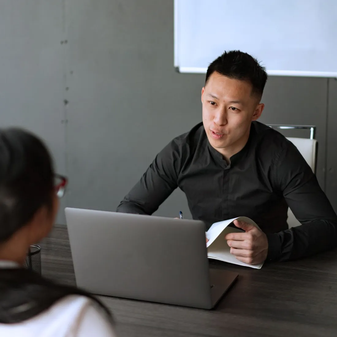 An INC.sg adviser going through the file with a client
